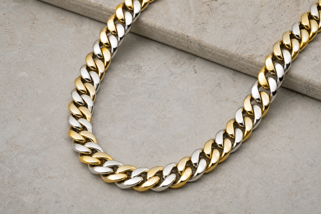 Men's Cuban link chain on a neutral surface under soft lighting