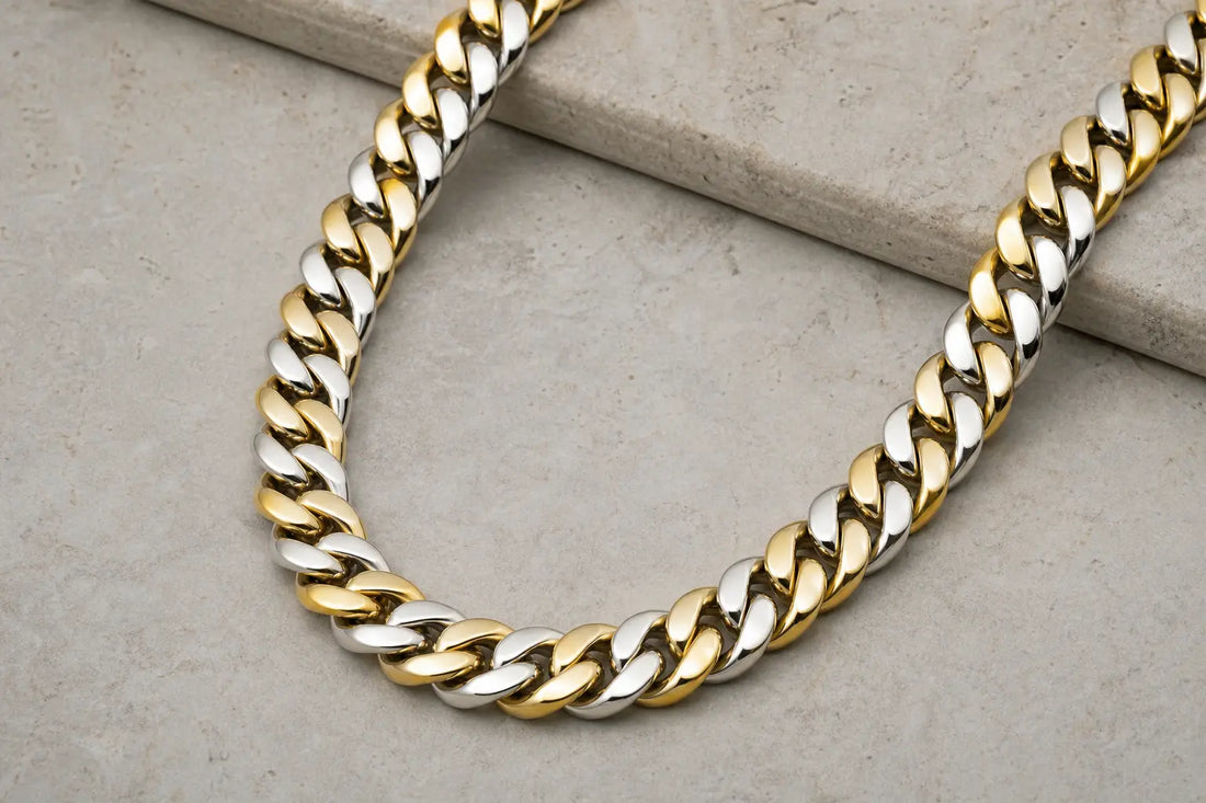 Men's Cuban link chain on a neutral surface under soft lighting
