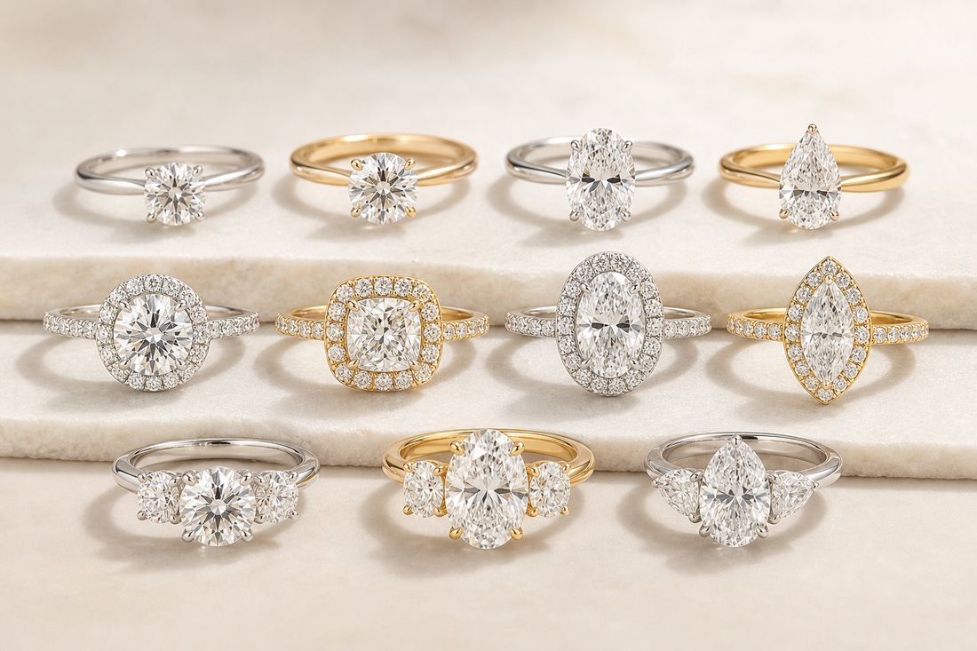 Several lab grown diamond engagement rings in different styles arranged on a neutral surface