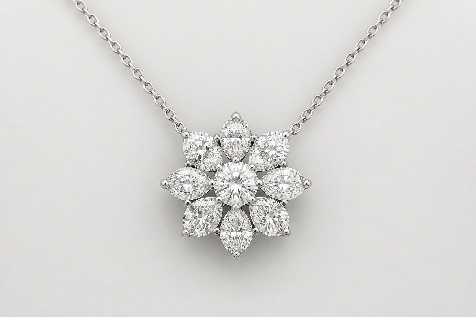 Diamond flower pendant necklace with a floral diamond cluster on a white gold chain against a neutral background