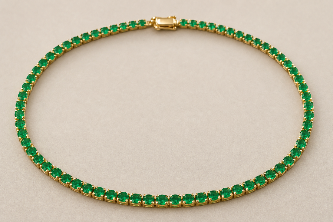 Emerald tennis necklace with a continuous row of green stones in a gold setting