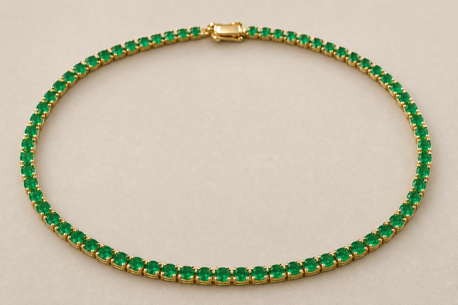 Emerald tennis necklace with a continuous row of green stones in a gold setting