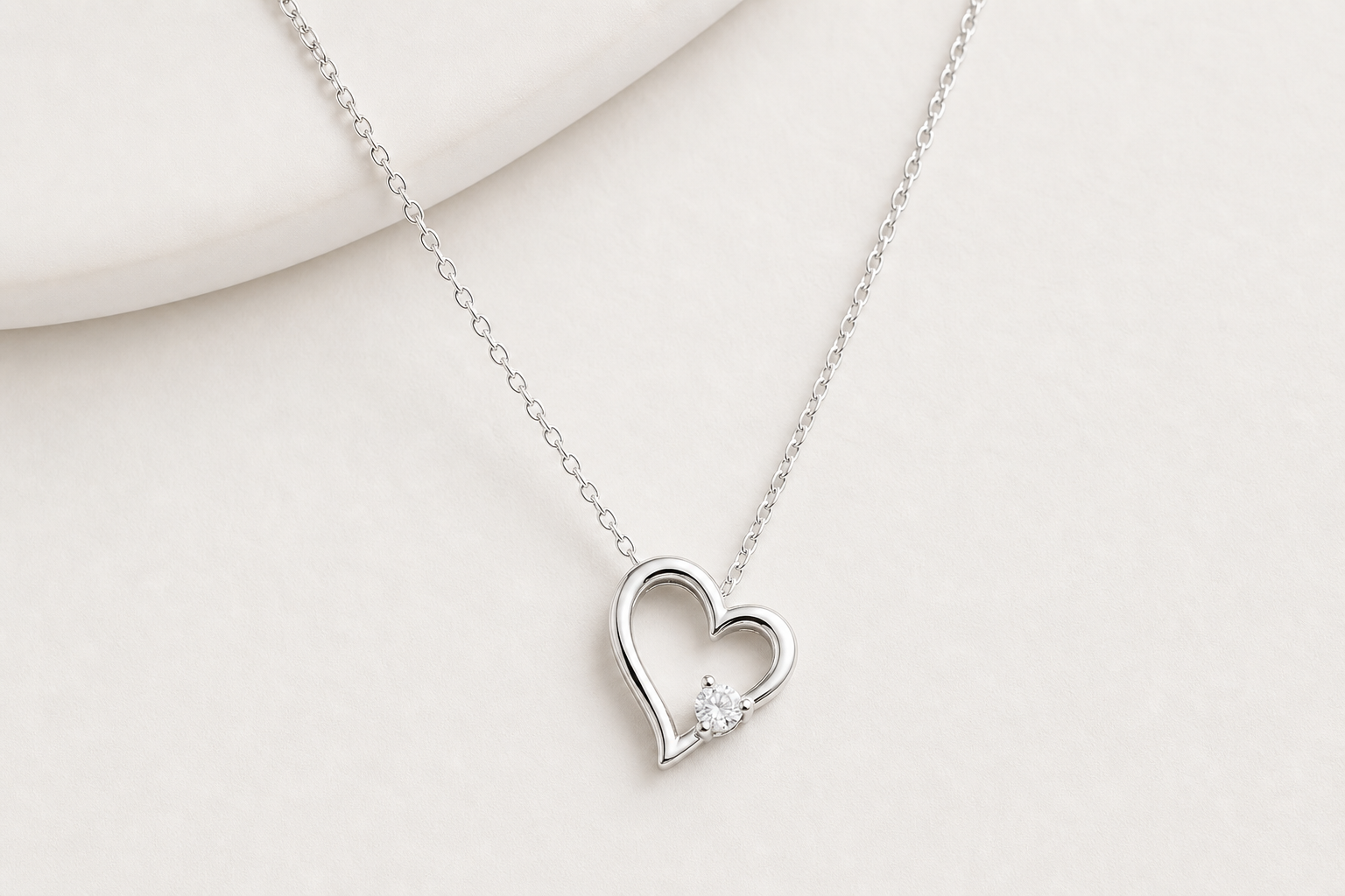 Women's sterling silver necklace on a light neutral background