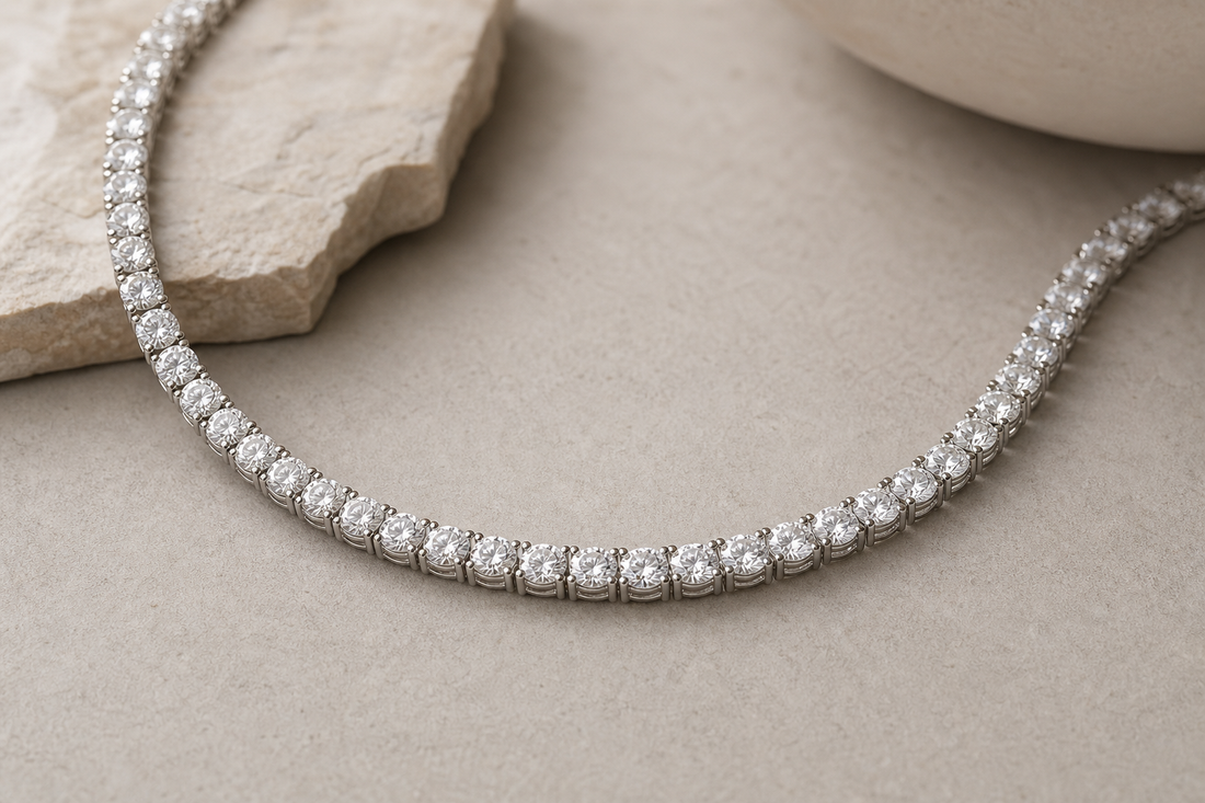 Diamond tennis necklace with a continuous row of matched stones on a neutral surface